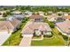 An aerial view of a lovely home featuring mature trees and landscaping at 13922 Talmage Loop, Hudson, FL 34667