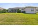 Lush backyard featuring a well-maintained lawn at 13922 Talmage Loop, Hudson, FL 34667