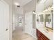 Bright bathroom with modern fixtures, including a sink, vanity, and well-lit mirror at 13922 Talmage Loop, Hudson, FL 34667