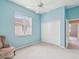 Well-lit bedroom with a closet and neutral carpet at 13922 Talmage Loop, Hudson, FL 34667