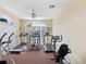 Well-equipped gym area with treadmills and elliptical machines for cardio fitness at 13922 Talmage Loop, Hudson, FL 34667