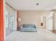 Comfortable living room with sliding doors to lanai, blue sofa, and laminate flooring at 13922 Talmage Loop, Hudson, FL 34667