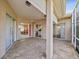 Open screened patio with brick flooring and natural light at 13922 Talmage Loop, Hudson, FL 34667