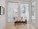 Sitting area with decorative glass windows and a view of the pool area at 1471 N Jasmine Ave, Tarpon Springs, FL 34689