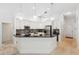 Bright kitchen featuring white cabinetry, granite countertops, and a large center island at 1471 N Jasmine Ave, Tarpon Springs, FL 34689