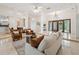 Inviting living space featuring marble floors, open layout, and views of the entryway and dining area at 1471 N Jasmine Ave, Tarpon Springs, FL 34689