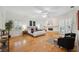 Large bedroom with wood floors, fireplace, and shutters for natural lighting at 1471 N Jasmine Ave, Tarpon Springs, FL 34689