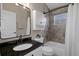 Beautiful bathroom with tiled walls, a shower-tub combo, and granite countertop vanity offering a luxurious and functional space at 1862 Wood Bend St, Tarpon Springs, FL 34689