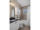 Well-lit bathroom featuring a tub-shower, sleek vanity with granite countertop, and modern fixtures, creating a refreshing space at 1862 Wood Bend St, Tarpon Springs, FL 34689