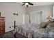 Bright bedroom features a ceiling fan, sliding doors, and dark wood floors at 1862 Wood Bend St, Tarpon Springs, FL 34689