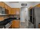 Modern kitchen with stainless steel appliances and ample cabinet space at 1862 Wood Bend St, Tarpon Springs, FL 34689