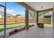 Relaxing screened lanai with an outdoor area and a view of the landscaped backyard providing space to relax or entertain at 1862 Wood Bend St, Tarpon Springs, FL 34689