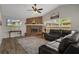 Bright living room with vaulted ceiling, fireplace and comfortable seating at 1862 Wood Bend St, Tarpon Springs, FL 34689