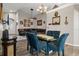 Open-concept living room with vaulted ceilings features a dining area and comfortable seating at 1862 Wood Bend St, Tarpon Springs, FL 34689