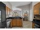 Open layout with kitchen view to the living room with comfortable seating at 1862 Wood Bend St, Tarpon Springs, FL 34689
