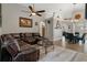 Inviting living room showcasing a comfortable leather sectional, round glass coffee table, and an open floor plan at 1862 Wood Bend St, Tarpon Springs, FL 34689