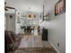 Spacious living room featuring tile floors, neutral walls, a ceiling fan, and an open layout flowing into the dining area at 1862 Wood Bend St, Tarpon Springs, FL 34689