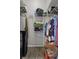 Walk-in closet with white wire shelving providing ample storage space for clothes and personal belongings at 1862 Wood Bend St, Tarpon Springs, FL 34689