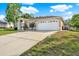 Well maintained home with a spacious driveway and a large garage, providing ample parking and storage at 2172 Whitewood Ave, Spring Hill, FL 34609