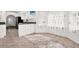 Eat-in kitchen has granite countertops and ceramic tile flooring at 2172 Whitewood Ave, Spring Hill, FL 34609