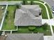 This aerial view reveals a well maintained home with tropical landscaping and a fenced backyard at 22316 Red Jacket Ln, Land O Lakes, FL 34639