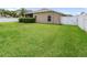 Grassy backyard with privacy fencing at 22316 Red Jacket Ln, Land O Lakes, FL 34639