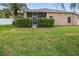 Picture of the backyard showing lawn, landscaping and perimeter privacy fence at 22316 Red Jacket Ln, Land O Lakes, FL 34639