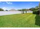 A spacious backyard features privacy fencing and lush green grass at 22316 Red Jacket Ln, Land O Lakes, FL 34639