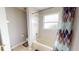 Clean bathroom features a white tub and shower with a patterned curtain and tiled walls at 22316 Red Jacket Ln, Land O Lakes, FL 34639