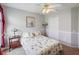 This carpeted bedroom features a ceiling fan, wall trim and a window to the outside at 22316 Red Jacket Ln, Land O Lakes, FL 34639