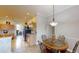 Dining area with a round table and seating for four, seamlessly connecting to the kitchen at 22316 Red Jacket Ln, Land O Lakes, FL 34639