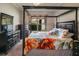 A bedroom offers a dark wood, four-poster bed with an upholstered headboard, dressers, and carpeted floors at 22316 Red Jacket Ln, Land O Lakes, FL 34639