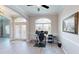 The office offers wood-look floors, a ceiling fan, lots of light, and glass-panel doors at 22316 Red Jacket Ln, Land O Lakes, FL 34639
