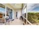 Relaxing screened-in patio with ceiling fan, seating, and sliding glass doors offers a private outdoor living space at 22316 Red Jacket Ln, Land O Lakes, FL 34639