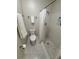 Bathroom with tiled shower, toilet, and towel rack at 2270 Alden Ln # A, Palm Harbor, FL 34683