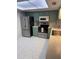Cozy kitchen featuring stainless steel appliances, light countertops and tile flooring at 2270 Alden Ln # A, Palm Harbor, FL 34683