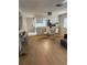 Open floor plan with wood flooring, a dining area, and a breakfast bar for casual dining at 2270 Alden Ln # A, Palm Harbor, FL 34683