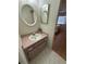 Compact vanity with a decorative mirror at 2270 Alden Ln # A, Palm Harbor, FL 34683