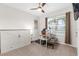 Neutral bedroom with closet, ceiling fan, and natural light from the window at 2572 Garden Plum Pl, Odessa, FL 33556