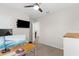Bedroom with a ceiling fan and access to the ensuite bathroom at 2572 Garden Plum Pl, Odessa, FL 33556