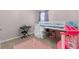 bedroom with a bunk bed, carpet, and a play area at 2572 Garden Plum Pl, Odessa, FL 33556