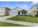 Charming single Gathering home with a 2 car garage and well manicured lawn at 2572 Garden Plum Pl, Odessa, FL 33556