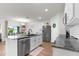 Modern kitchen featuring stainless steel appliances, granite countertops, and a center island with sink at 2572 Garden Plum Pl, Odessa, FL 33556
