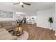 Open floor plan with living room, dining area, and kitchen visible, offering a spacious and connected living space at 2572 Garden Plum Pl, Odessa, FL 33556