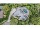 Aerial view of the property highlighting the screened pool, landscaping and privacy at 2880 Chelsea N Pl, Clearwater, FL 33759