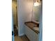 Bathroom vanity with granite countertop, sink, and mirror at 2880 Chelsea N Pl, Clearwater, FL 33759