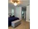 Comfortable bedroom features a ceiling fan and access to other rooms at 2880 Chelsea N Pl, Clearwater, FL 33759