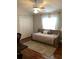 Bedroom with hardwood floors, a ceiling fan, and natural light at 2880 Chelsea N Pl, Clearwater, FL 33759