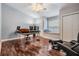Office space boasts hardwood floors, natural light from a window seat, and a vaulted ceiling at 2880 Chelsea N Pl, Clearwater, FL 33759