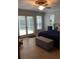 Cozy bedroom featuring french doors to a screened in lanai at 2880 Chelsea N Pl, Clearwater, FL 33759